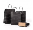 Черный крафт-пакет с кручеными ручками и прямоугольным дном для упаковки товаров